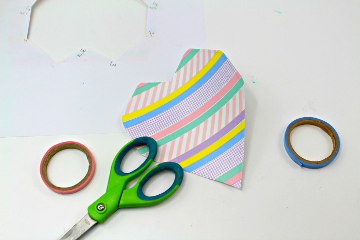 Add washi tape to your heart for your DIY Valentine's Day craft.