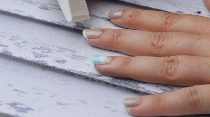 Beach Waves Nail Art Design: Add white polish to the tips of your nails.