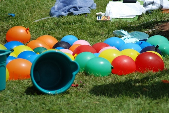 Water Balloon fights are fun outside party games for kids!