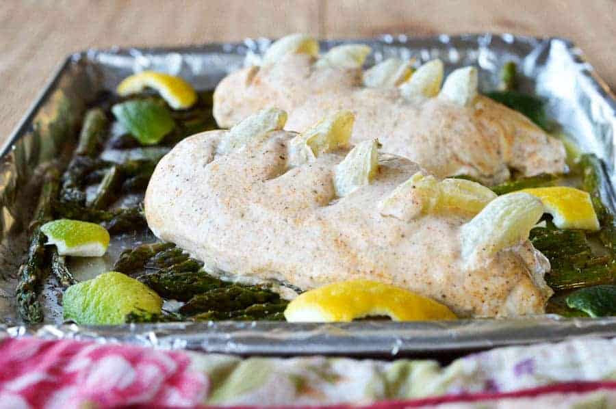 Tired of eating the same old go-to recipes for dinner every week? You have to try this insanely delicious sheet pan lemon lime chicken with asparagus! Check it out!