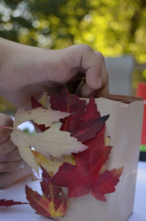 Adding leaves to this easy fall craft for kids